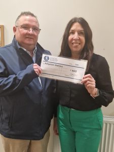 Finance and Business Service Manager Karen Davies receives £500 cheque from The Chester Bluecoat CEO Mike Jenkins
