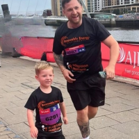Hugo running with his Dad for Adoption Matters